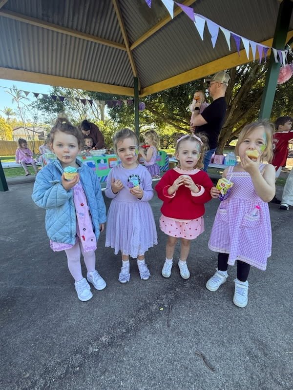 Party guests enjoying cupcakes
