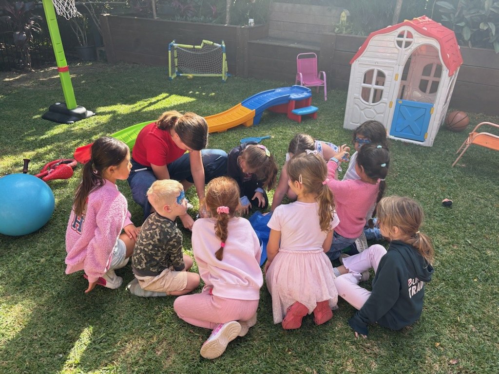 Sienna running a group activity with kids